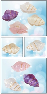 Détail de pinces à cheveux coquillage avec fini nacré et lignes dorées en quatre tons
