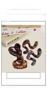Close-up detail of tortoiseshell hair claw clips and wavy hair pins on vintage books