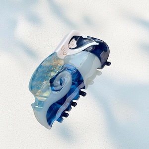 Artistic mermaid hair claw clip in ocean blue and white acetate with golden fish scales