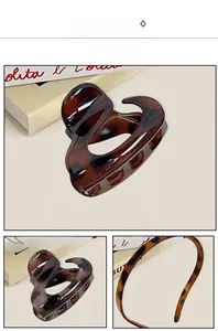 Close-up of tortoise shell pattern texture on high-gloss resin hair claw and headband