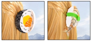 Dettaglio di fermacelli per capelli sushi creativi con design di salmone e gamberetto
