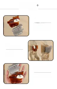 Detail showing the polished acetate finish of cute brown bear and grey elephant hair clips