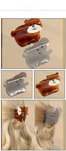 Detail shots of cute bear and elephant hair claws showing the smooth acetate texture