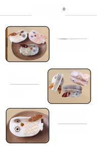 Detail view of acetate owl hair claw clips with marble texture and rhinestone eyes