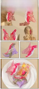 Detailed close-up showing various colorful acetate dinosaur hair claws with non-slip teeth