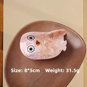 Pink marble acetate owl hair claw clip with rhinestones and gold edges measuring 8x5cm