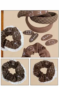 Detail view of coffee plaid bear hair accessories set with lace and embroidery