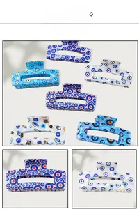 Macro detail of rectangle Evil Eye hair claw clips with pearlescent blue and purple finish