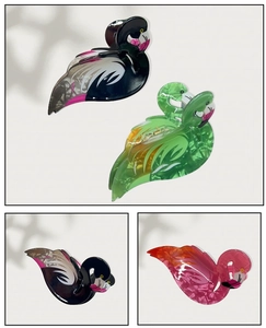 Close-up of Flamingo-shaped PVC hair claws in candy colors with marble texture and spring