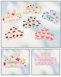 Close-up of assorted floral and heart pattern hair claws with high gloss acetate finish