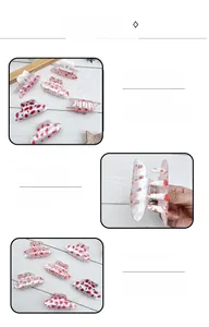 Detailed view of red heart and lip pattern acrylic cowboy hat hair claw clips for styling