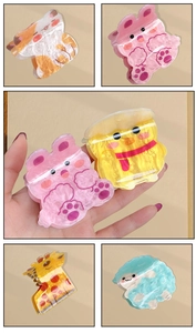 Detailed view of colorful cartoon animal hair claws with marbled acrylic texture