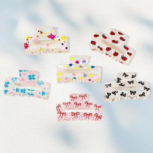 Set of six cute Korean style hair claws with floral, ladybug and heart patterns