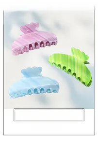 Detail of macaron gradient acetate hair clips showing shell edge and vertical textures