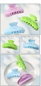 Detail of candy-colored acetate hair claws with marble texture in various angles