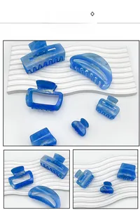 Detailed views of starry sky blue marble acrylic hair claws in multiple geometric shapes