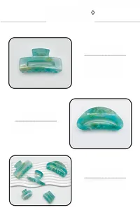 Detailed view of mint green acrylic hair claw clips with elegant marble patterns