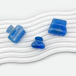 Starry blue acrylic hair claw set with marbled texture for women elegant styling