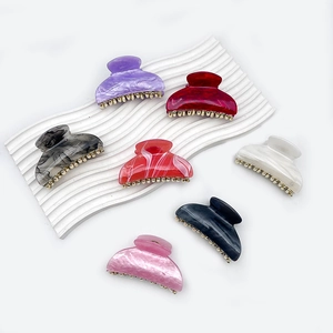 Set of colorful marble pattern acrylic hair claws with gold metal teeth and bead accents