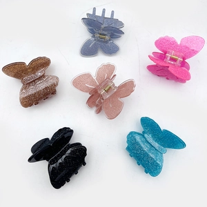 Set di sei fermagli per capelli a farfalla in acrilico glitterato in vari colori