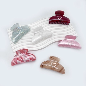 Chic acrylic heart claw clips set in multi-color marble and pastel finishes