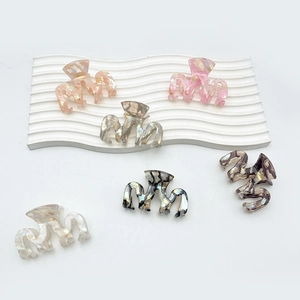 Set of six minimalist wave-shaped marble texture hair claws in various elegant colors