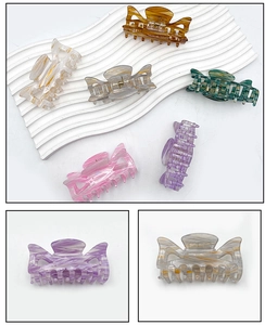 Detail of marble pattern acetate hair claw clip with strong metal spring mechanism