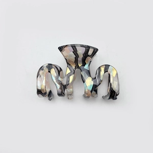 Minimalist geometric wave hair claw with iridescent sequins in a colorful shell pattern