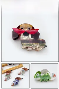 Collage of acetate animal hair claws including dachshunds and chameleons in various patterns