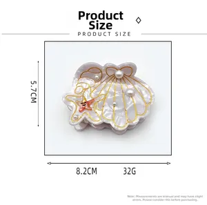 Détails de la pince à cheveux coquillage et étoile de mer, dimensions 8,2 cm x 5,7 cm