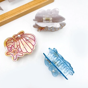Lot de trois pinces à cheveux thème océan avec perles en jaune, violet et bleu