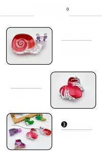 Detail view of acetate claw clips in fun snail, heart, and caterpillar shapes