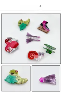 Close-up detail of creative acrylic hair claw clips featuring colorful cartoon animal shapes