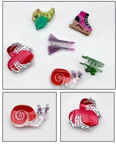 Detailed set of novelty Halloween hair clips including caterpillar and roller skate designs