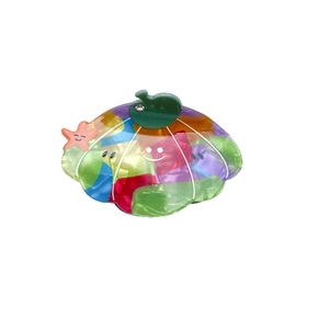 Colorful cartoon scallop hair claw clip with shell mosaic pattern and star details