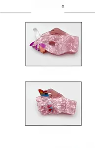 Detail view of unique cigarette and lighter acrylic hair claws with floral patterns