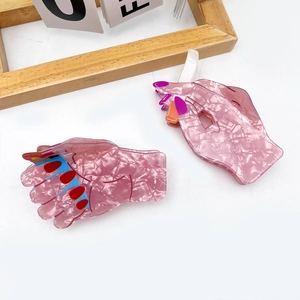 Creative pink acetate hand claw hair clips with colorful painted nail art details