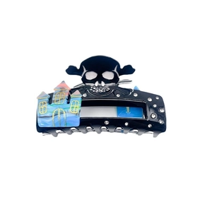 Gothic skull and castle hair claw clip with acetate finish and sparkling rhinestones