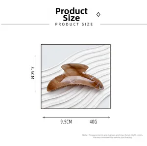 Detailed size view of crescent amber acrylic hair claw clip with 9.5cm length measurement