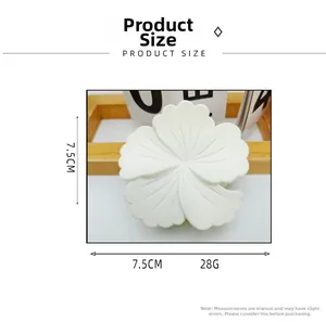 Detailed size view of the 7.5cm white resin flower hair claw clip on wood stand