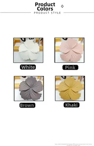 Detail view of flower-shaped matte hair claws in white, pink, brown, and khaki colors