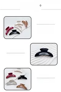 Detail of colorful crescent hair claws in black, wine red, and marble patterns