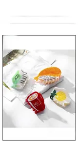Detailed macro view of acetate food-shaped hair clips including milk box and sushi designs