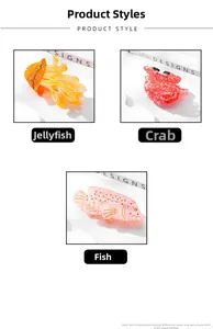 Detailed close-up of ocean-themed acetate hair claws featuring jellyfish, crab and fish