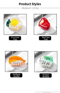 Detailed view of acetic hair clips in fried egg and milk bottle food shaped designs
