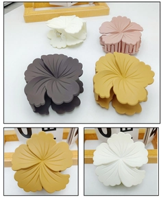 Detail view showing matte texture and strong metal spring of hibiscus flower hair claws