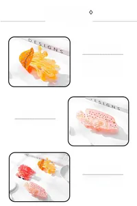 Detailed macro view of ocean-themed jellyfish and fish hair clips with mini rhinestones