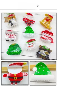Detailansicht der Weihnachts-Haarklammern mit Weihnachtsmann- und Rentier-Motiven