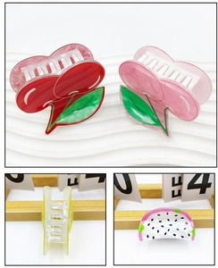 Detail view of cute cherry and watermelon fruit hair claws with strong grip teeth