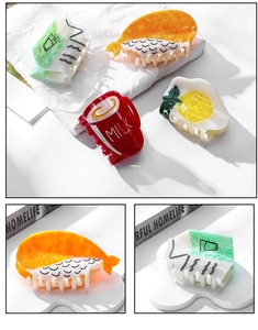 Detail of creative food-shaped hair claws like salmon sushi and milk carton hair clips